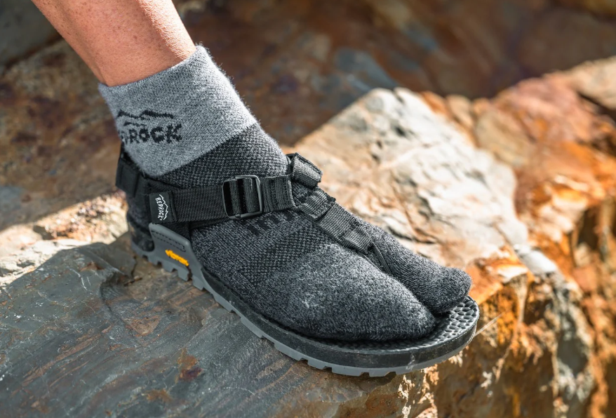 injinji bedrock split toe sock on a foot on a shoe