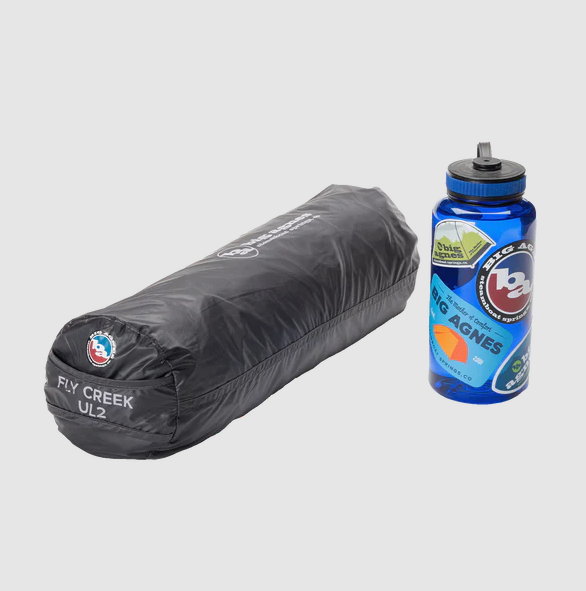 big agnes fly creek ultralight 2 in stuff sack next to water bottle