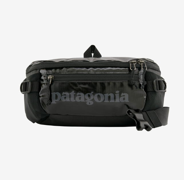 the patagonia black hole waist pack in the color black, front view