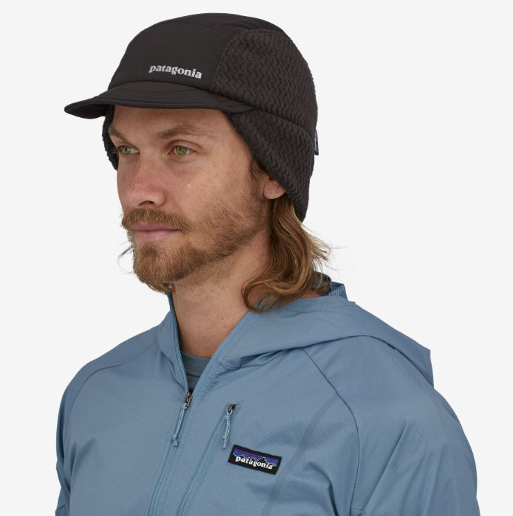 photo of the patagonia winter duckbill running cap in the color black, three quarters view on a model