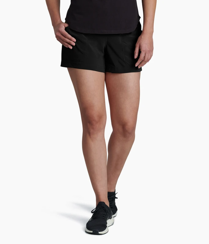 a model wearing the kuhl vantage four inch shorts in the color black, front view