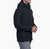 a model wearing the kuhl relik hoody in carbon, side view