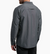 a model wearing the kuhl airspeed long sleeve mens shirt in the color carbon, back view