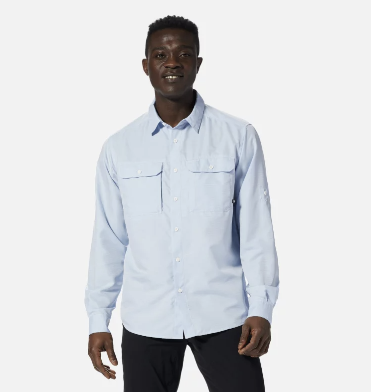 The mountain hardwear mens canyon long sleeve shirt in the color blue chambrey, front view on a model