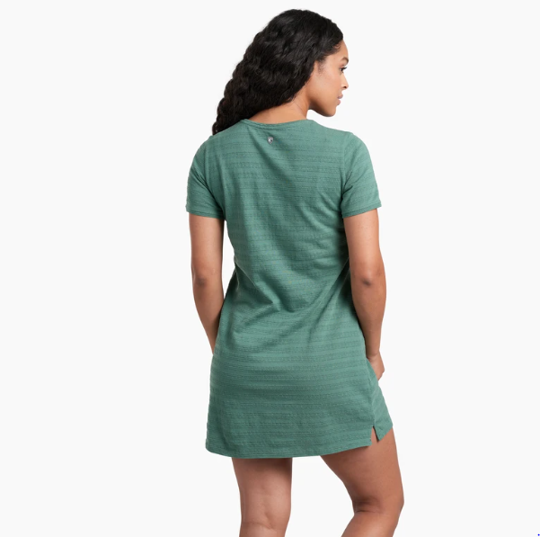 a model wearing the kuhl willa tee shirt dress in the color evergreen, back view