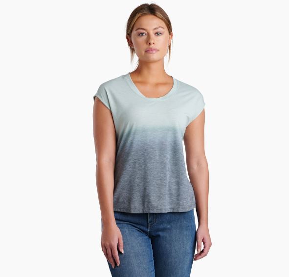 a model wearing the kuhl womens isla short sleeve shirt in the color eucalyptus, front view
