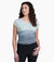 a model wearing the kuhl womens isla short sleeve shirt in the color eucalyptus, front view with the back tied
