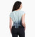 a model wearing the kuhl womens isla short sleeve shirt in the color eucalyptus, back view with the back tied