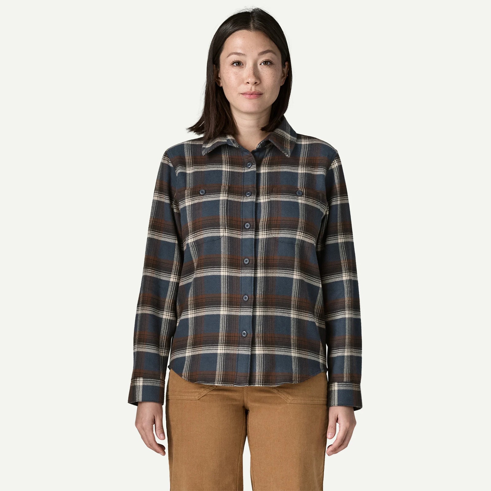 woman wearing blue and brown flannel shirt