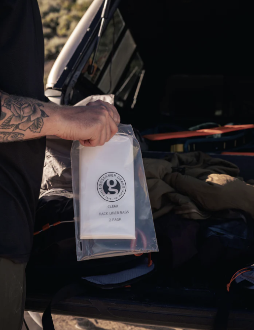 gossamer gear pack liner being held by someone