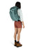 a photo of the osprey mira 22 pack in the color succulent green, back view on a model
