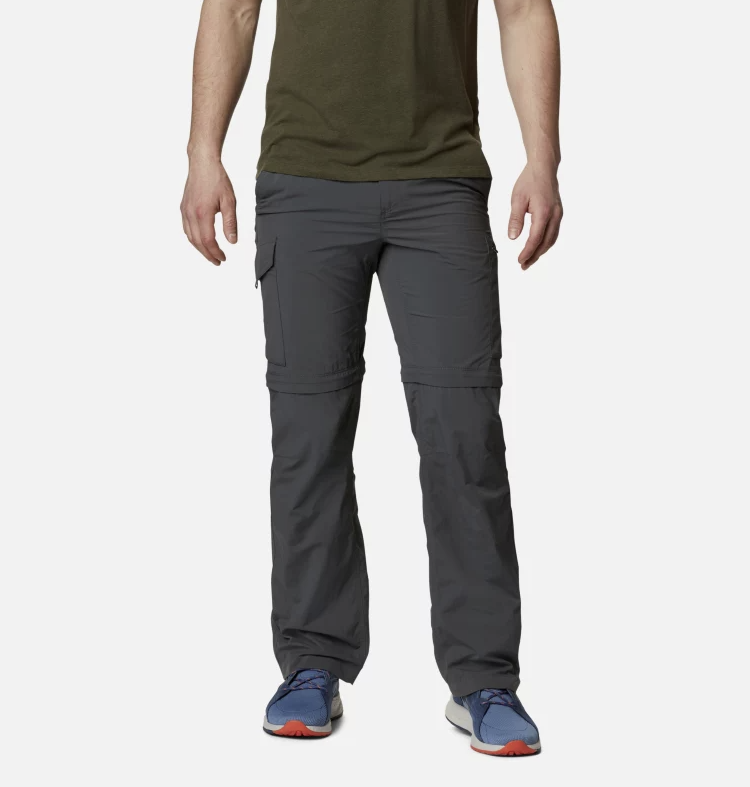 a photo of a model wearing the columbia silver ridge convertible pants in the color grill, front view