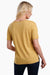 the kuhl women's mountain sketch tee in the color honey, back view on a model