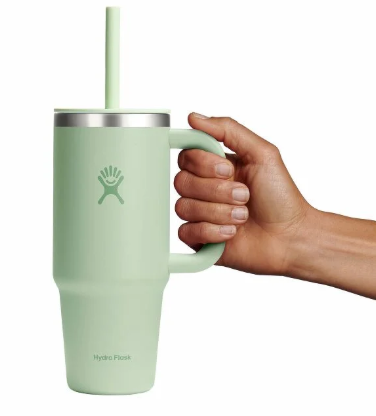 hydroflask 24 oz tumbler in aloe with a hand