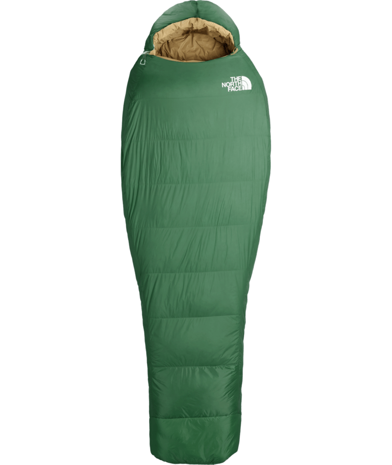 A green mummy-style sleeping bag with a tan interior lining and a white embroidered logo of The North Face on the chest, shown against a plain white background.