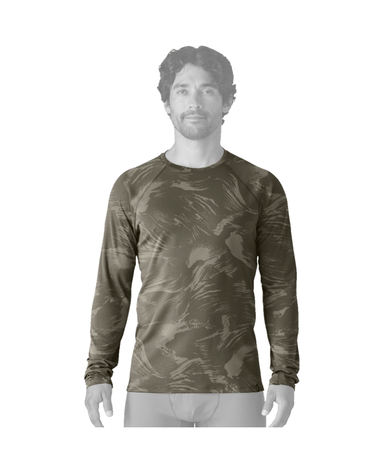 A man wearing a long-sleeve athletic shirt with an abstract camouflage pattern in olive green, brown, and dark gray, 