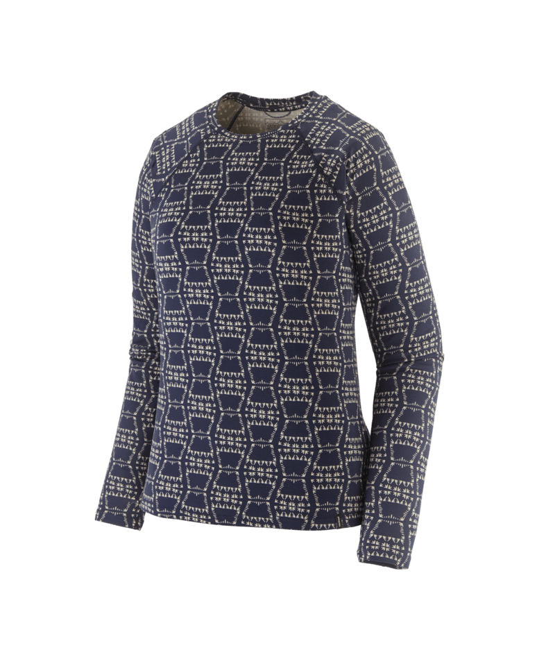 A long-sleeve crewneck sweater featuring an all-over geometric pattern of interlocking hexagons in cream and dark navy blue