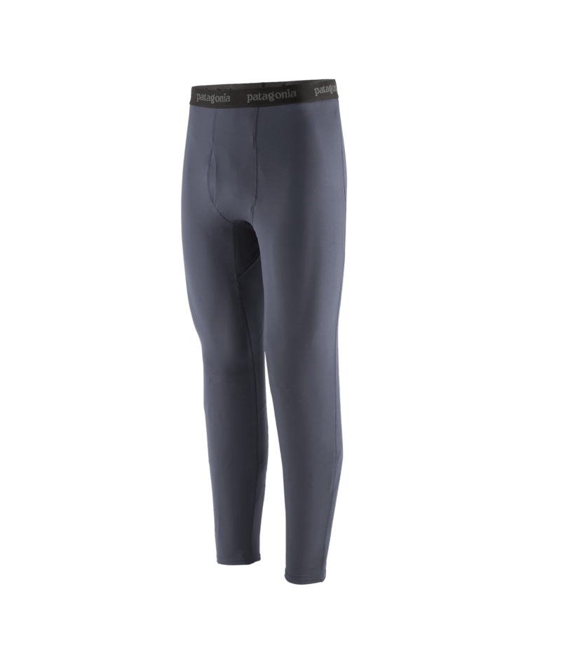 A pair of men's full-length base layer leggings in a muted slate gray / blue color, featuring a dark elastic waistband with the brand name 'patagonia' printed in white. 