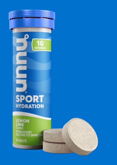 a bottle of nuun and some tablets in the flavor lemon lime