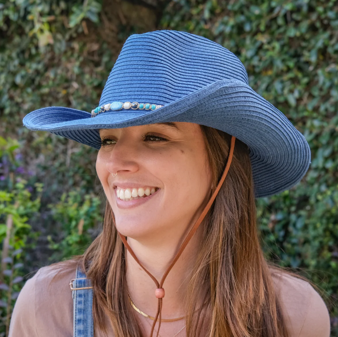 the sunday afternoons kestrel hat in color horizon being worn by a model