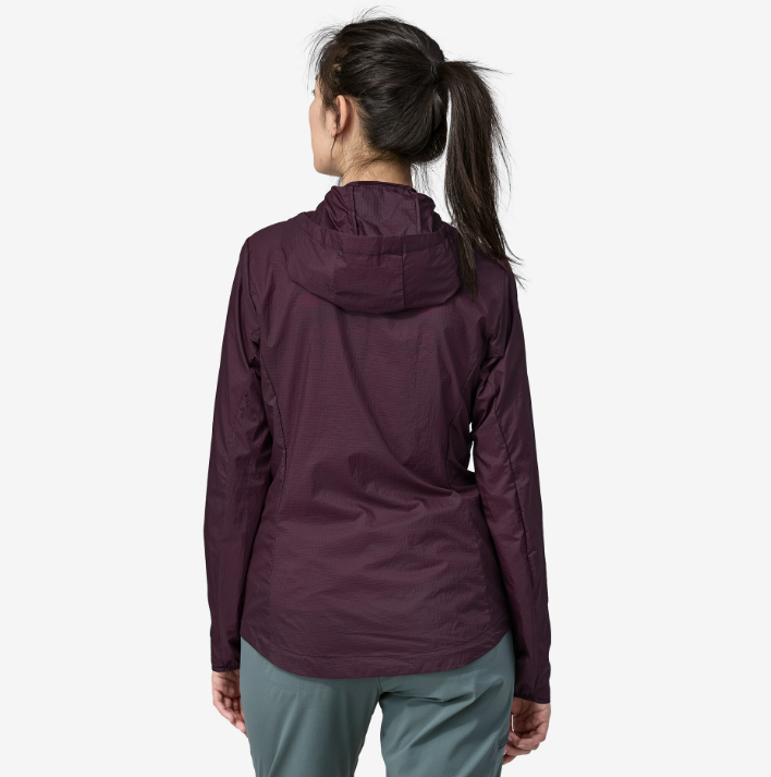 patagonia womens houdini jacket in the color night plum, back view on a model
