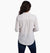 a model wearing the kuhl adele long sleeve shirt in natural back view