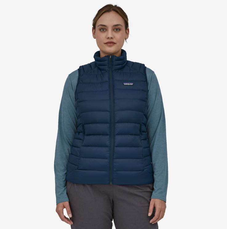 patagonia womens down sweater vest in the color new navy, front view on a model