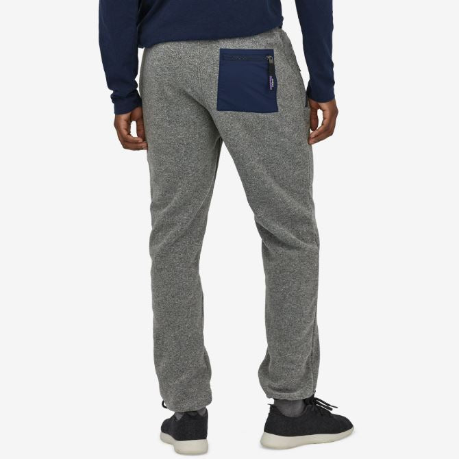 a photo of the mens patagonia synchilla fleece pant in the color nickel, back view on a model