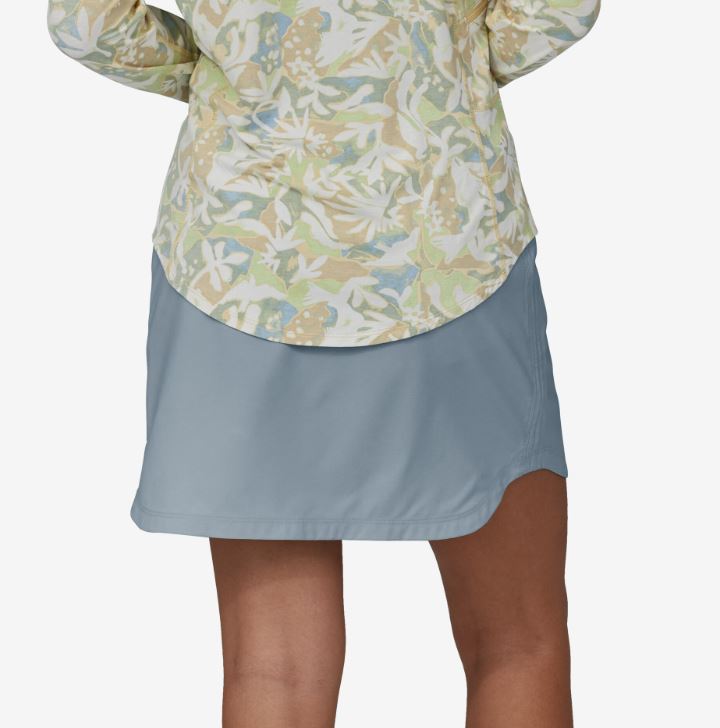 a photo of the patagonia womens tech skort in the color steam blue, back view on a model