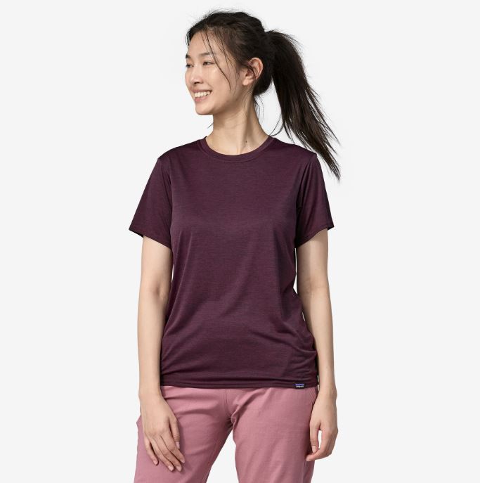 a photo of the patagonia womens capilene cool daily shirt in the color night plum obsidian plum x dye,front view on a model