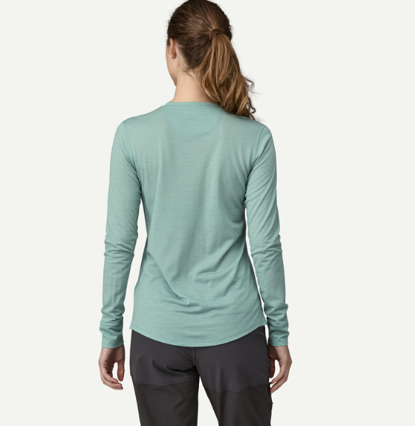 patagonia womens capilene cool long sleeve shirt merino blend in thermal blue, back view on a model
