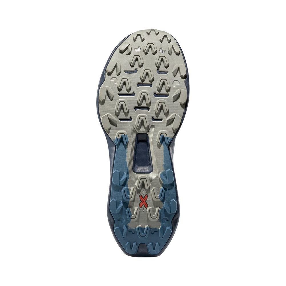 Close-up of a shoe sole with a brand logo on a white background
