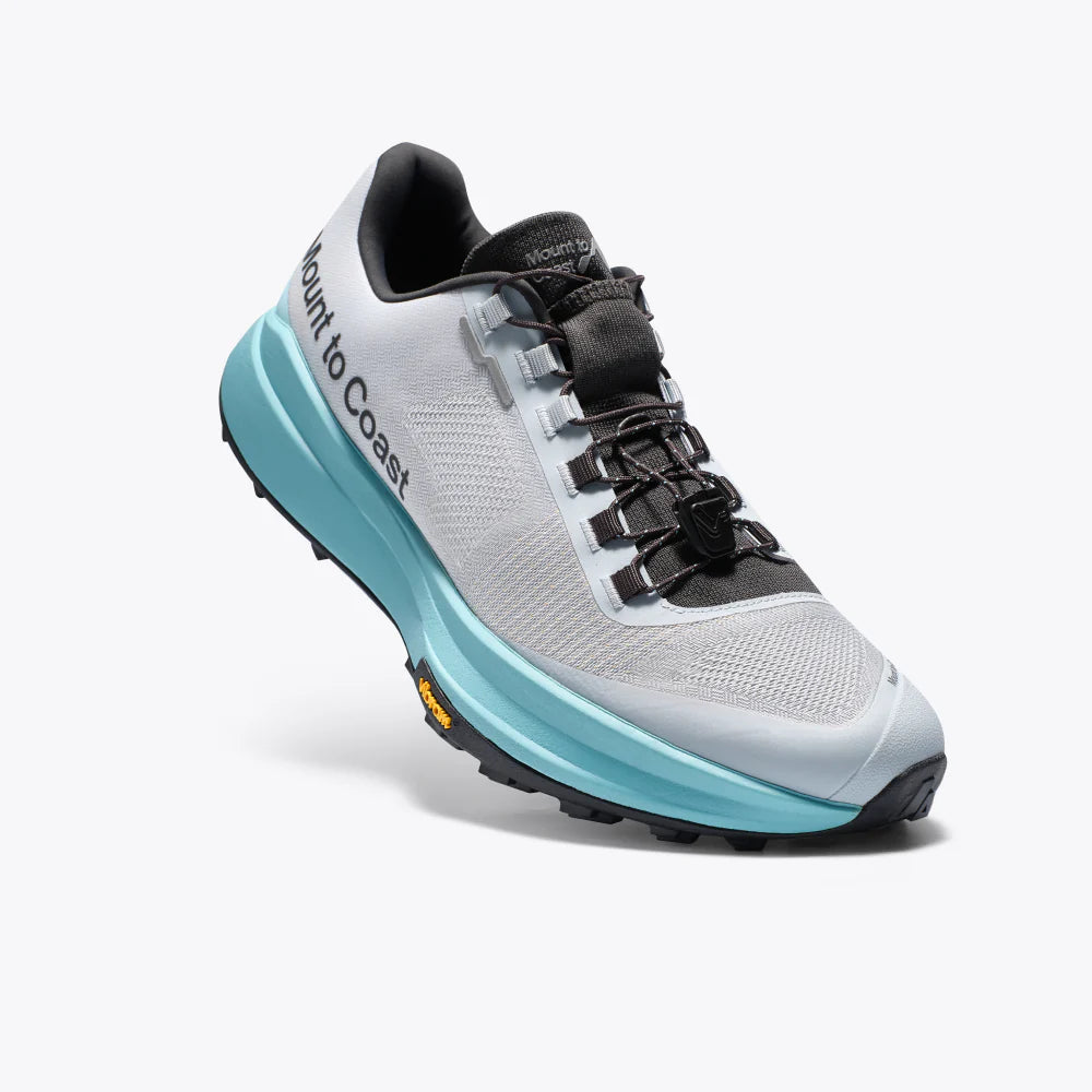 Gray and teal running shoe with black accents on a white background