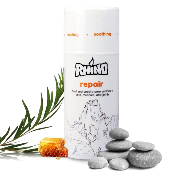 Rhino repair product with stones and leaves on a white background