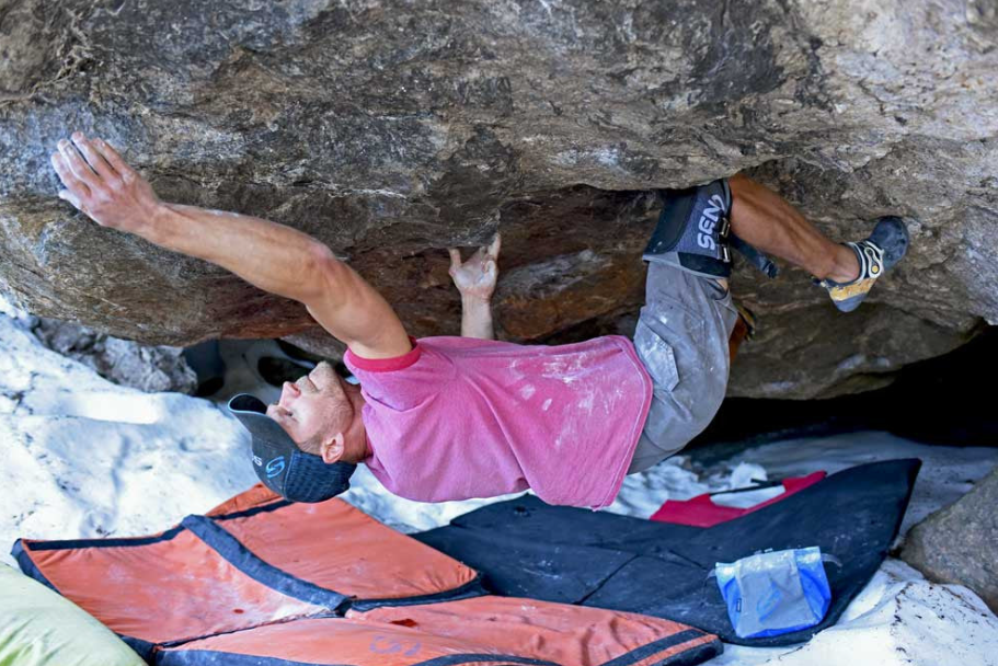send large slim knee pad shown on a model while climbing