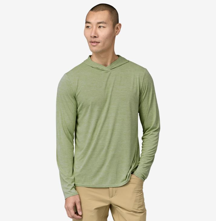 the mens patagonia capilene cool daily hoody in the color salvia green, front view on a model