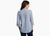 a model wearing the kuhl womens adele long sleeve shirt in the color blue storm, back view