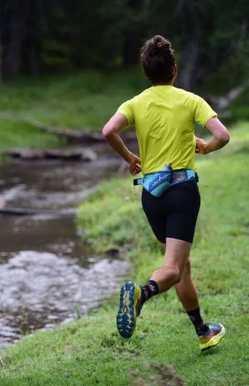 the ultraspire synaptic 2 waistpack shown on a person running