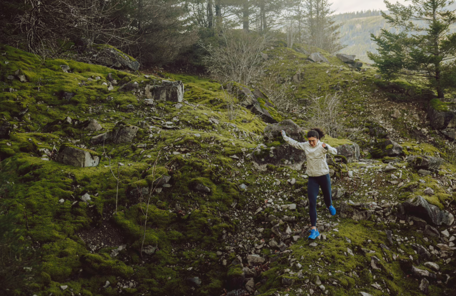 topo womens mtn racer 4 in blue a woman running in them