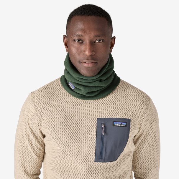 patagonia micro d gaiter in torrey pine green on a model