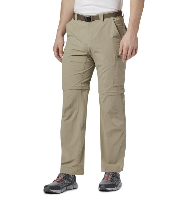 a photo of a model wearing the columbia silver ridge convertible pants in the color tusk, front view