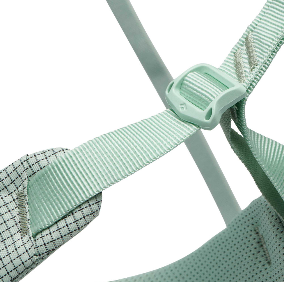 the black diamond womens momentum harness in the color sage, detail view of the leg adjustment system