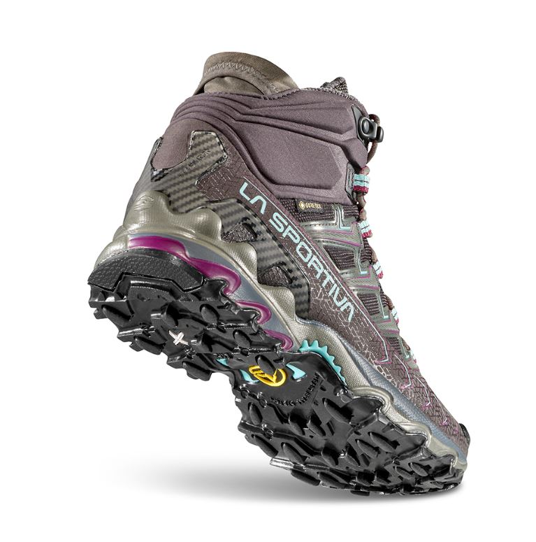 a photo of the la sportiva womens ultra raptor ii mid gtx hiking boot in the color carbon/iceberg, view of the sole and the back of the shoe