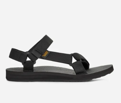 the teva women's original universal sandal in black, side view