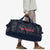 patagonia black hole duffel 100 litres in classic navy, being carried by a model