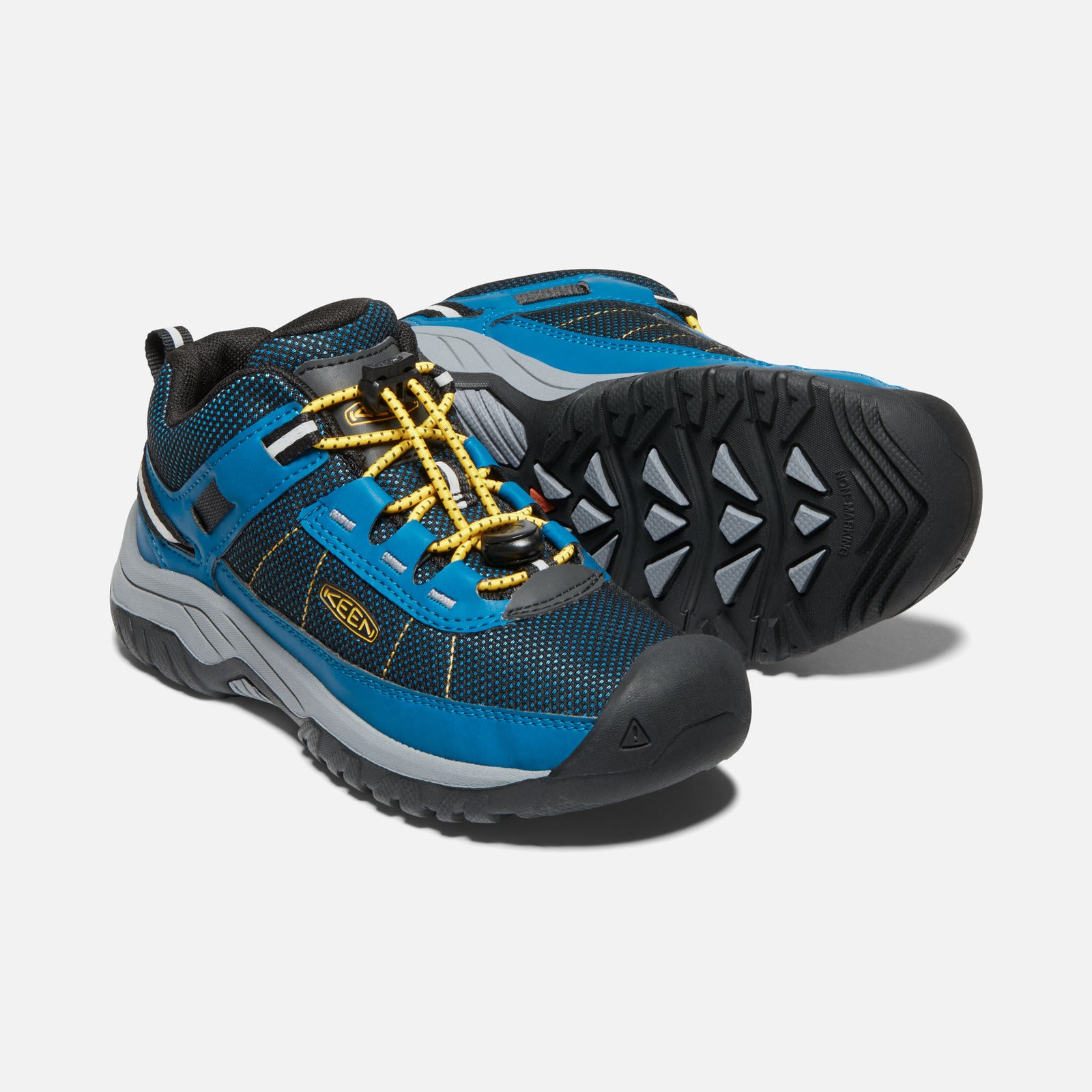 side view of a pair showing the side of one and the sole of another