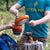 The minimo stove in use pouring food out of a fry pan