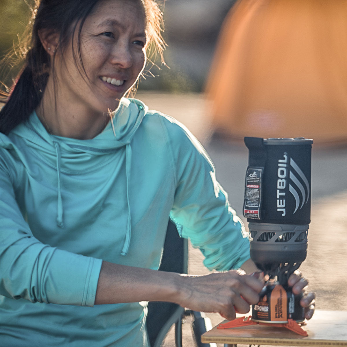 a woman uses a jetboil flash