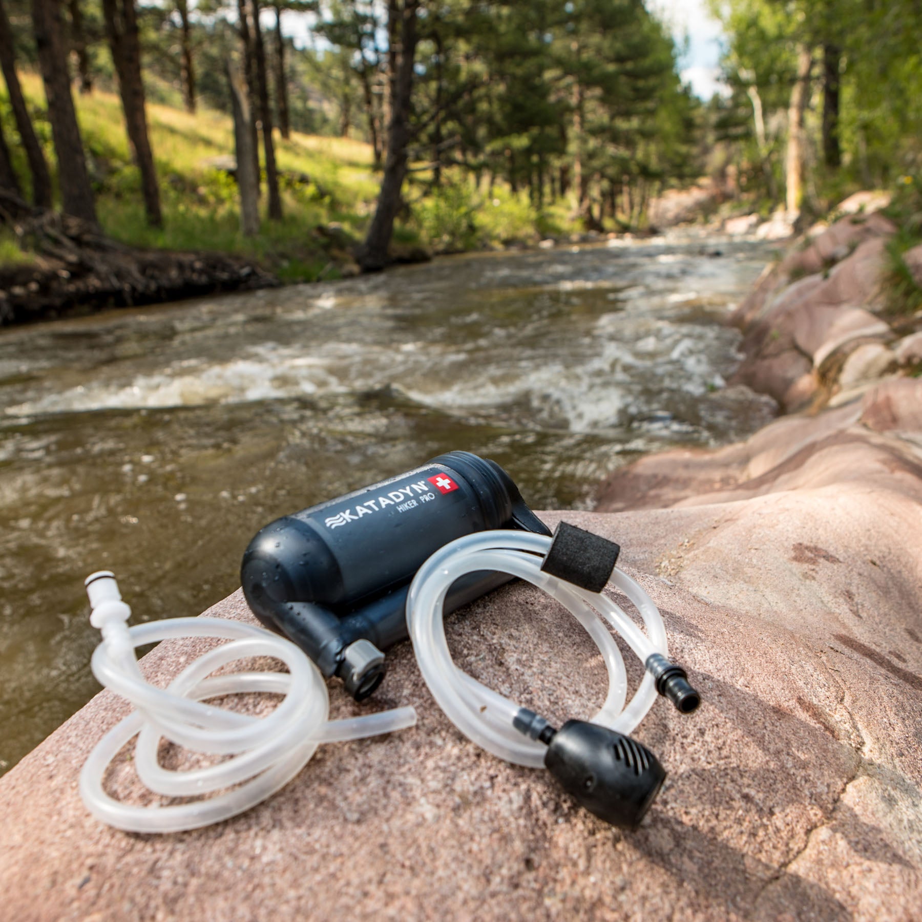 after use a hiker pro filter and coiled tubing on a rock by a stream