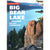 a person climbs a rock tower above Big Bear lake, on the cover of the Big Bear Lakes climbing guide